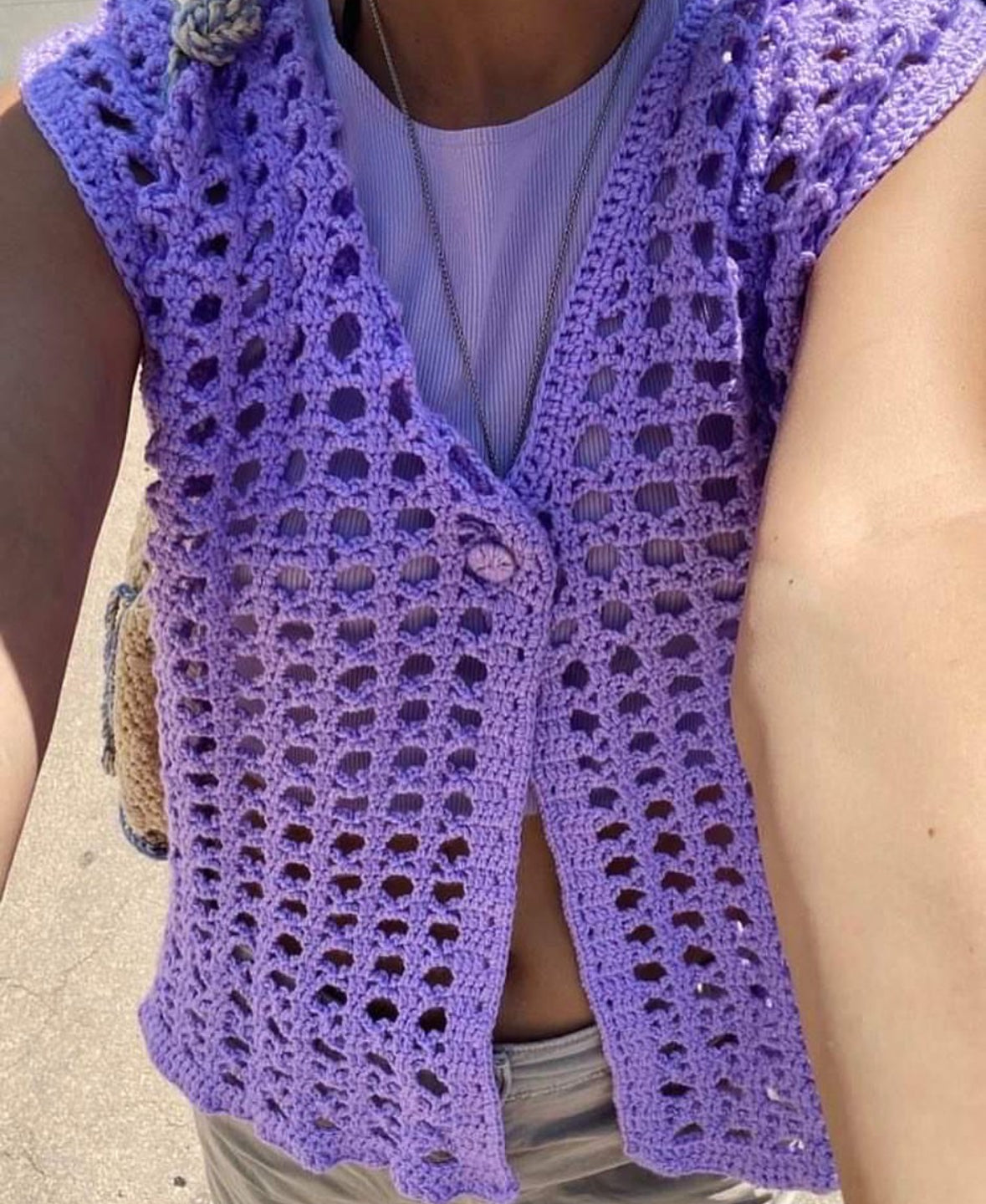 Close-up of a lavender handmade crochet vest